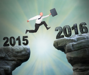 Businessman jumps to The New Year 2016.